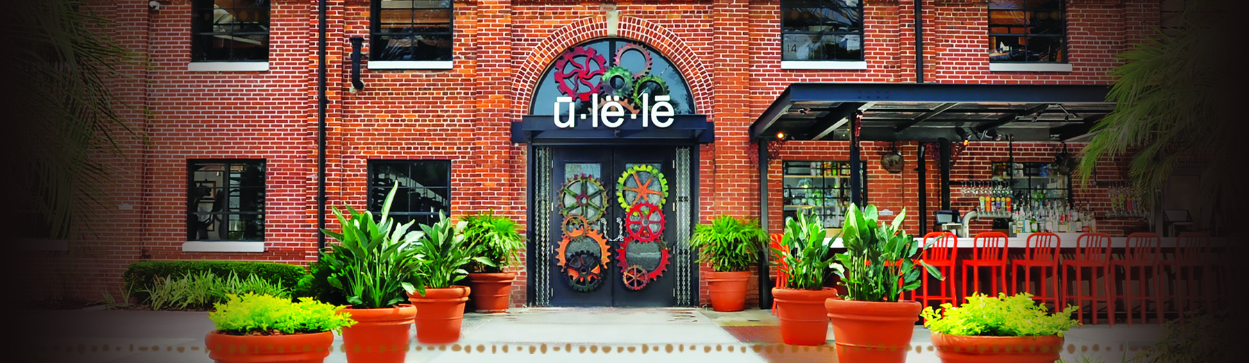 Ulele red-brick Water Works building with colorful gear doors in Tampa